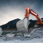 Orange Excavator Cutting Word Count of Rocks